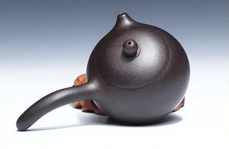 茶壶握持的艺术与实用哲学：从“錾”到提梁的壶把解密