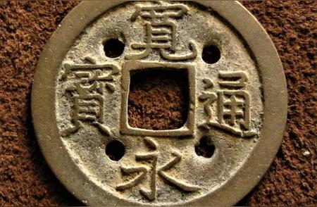 揭秘“四目”铜币：千年的寓意与用途传承